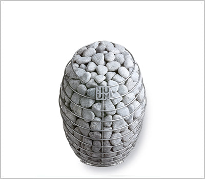 HUUM floor-standing sauna heater filled with rounded sauna stones